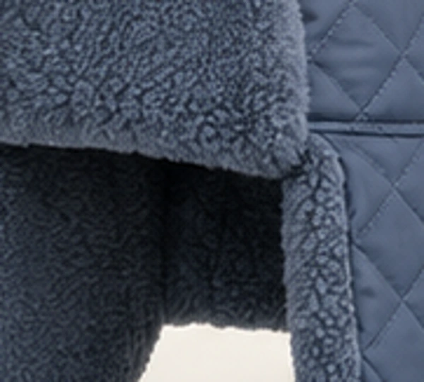 Sever Quilted Trapper, close-up of Slate Blue material and trim
